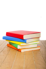 Fototapeta na wymiar colorful books on wooden table