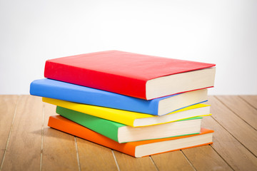 colorful books on wooden table