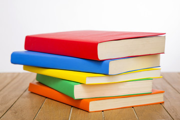 colorful books on wooden table