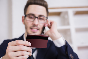 Businessman placing order by phone