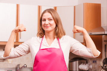 Happy housewife in kitchen