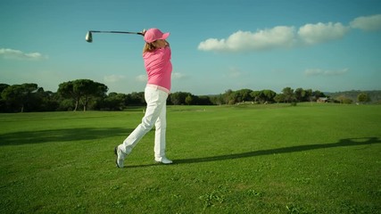 beautiful senior female golf player golf course