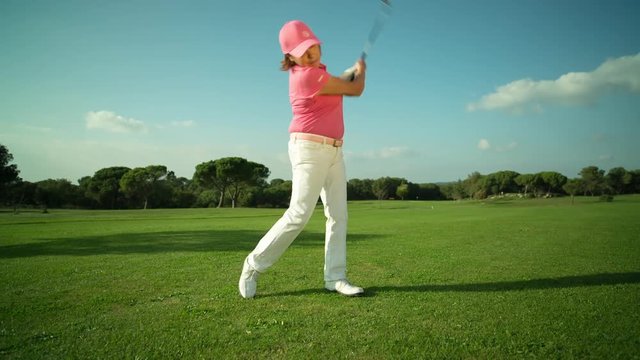 beautiful senior female golf player golf course