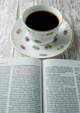Open Bible with a cup of Coffee or Tea