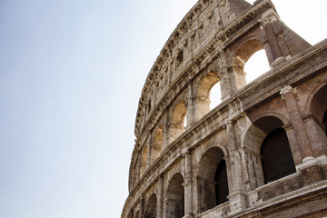 Obraz premium Bottom view of Colesseum with sky background in ancient Rome city