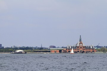 view of Ellis Island from Battery park esplanade