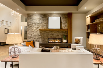 Beautiful living room interior with hardwood floors and fireplace in new luxury home
