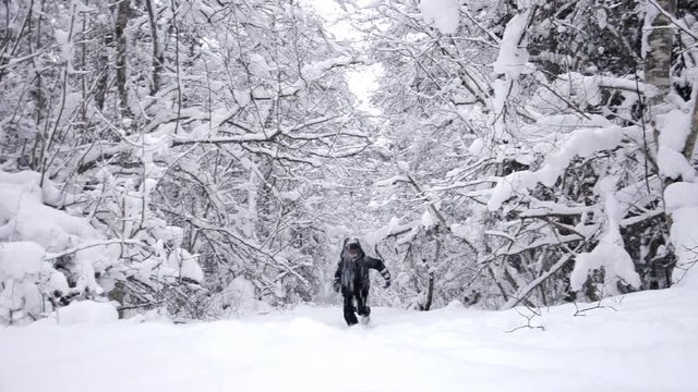 Young boy in winter forest