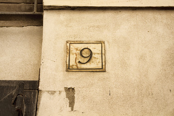 Engraved old building number 9 in Rome