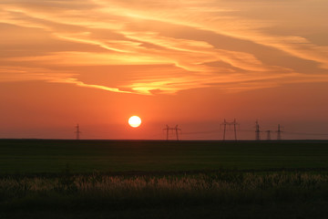Power lines against the background of a beautiful sunset