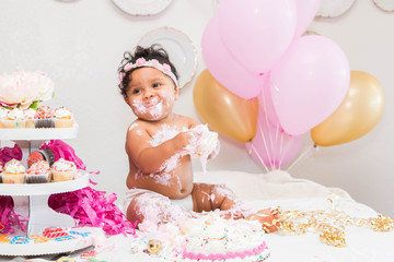 Baby Girl With Cake and Balloons