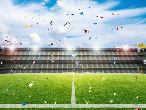 confetti celebration with soccer field background