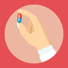 Hand holding a pill - flat style