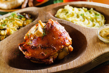 eisbein with braised cabbage, salad and beer