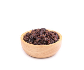 Raisin in wooden bowl isolated on white background