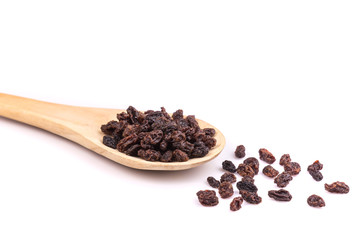Raisin in wooden spoon  isolated on white background