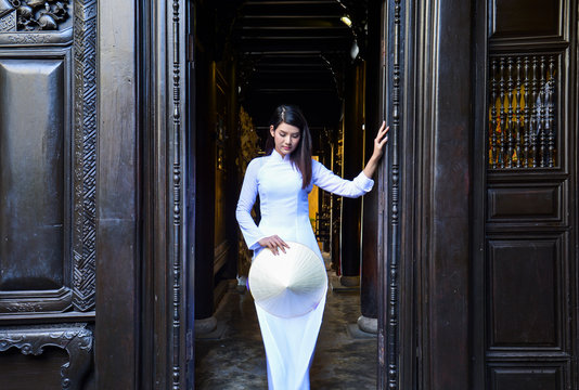 Beautiful  woman with Vietnam culture traditional dress,Ao dai is famous traditional costume ,vintage style,Hoi an Vietnam