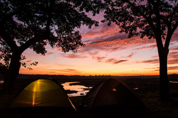 Fototapeta na wymiar Sunset/sunrise with camping tents at 3000 Boke, Ubon Ratchathani