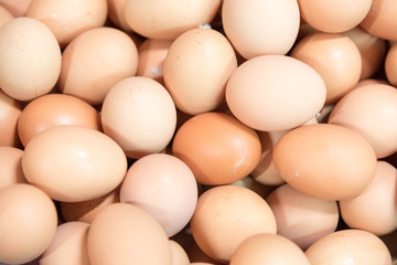 close up pile of fresh chicken eggs in the market