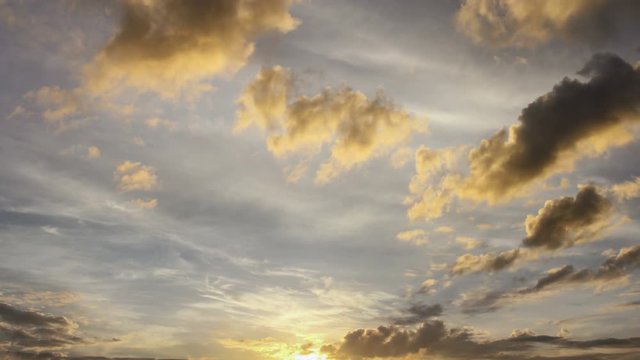 Time lapse sunrise yellow fluffy clouds over sky