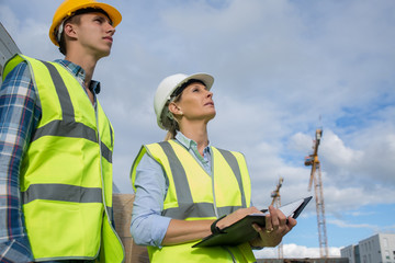 Portrait of builder works at construction site