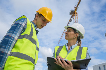 Portrait of builder works at construction site