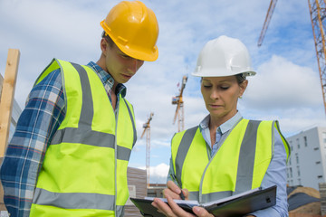 Portrait of builder works at construction site