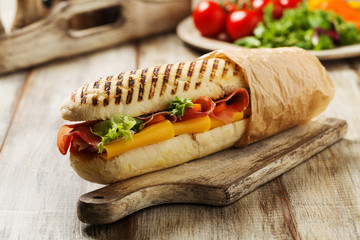 Traditional Italian sandwich with ham and cheese served warm.