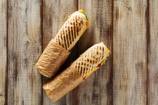 Traditional Italian sandwich with ham and cheese served warm.