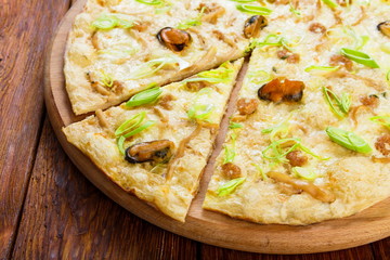 Delicious seafood pizza with olives