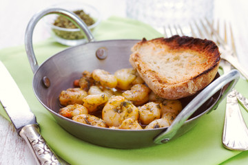 fried shrimps with bread on dish