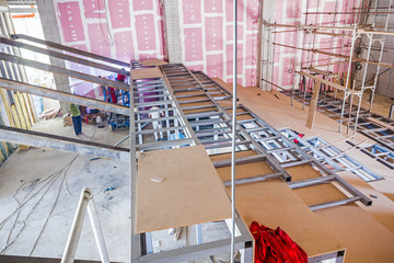 Structure girders on metal skeleton at indoor building site