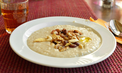 Organic oatmeal porridge with different nuts. 