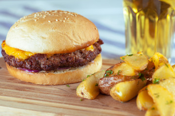burger and french fries on wooden table