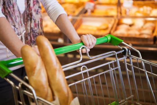 Woman Buying Fresh Bread