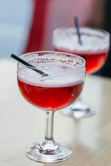 Glass of Red Cold Lemonade in the Cafe, Close-up