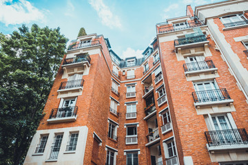 Low angle view on red brick apartment exterior