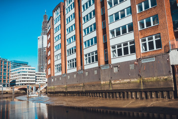 Lofts built on bedrock surrounded by river