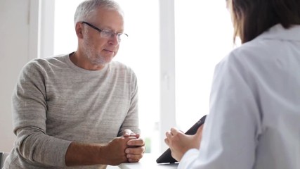 senior man and doctor with tablet pc at hospital 51