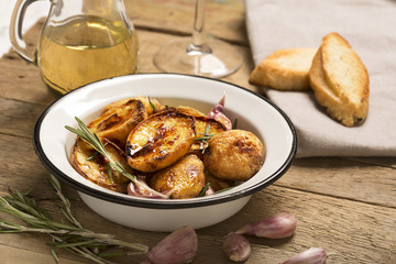 Baked potato with garlic and herbs
