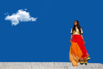 Young beautiful traditional indian woman standing outdoors
