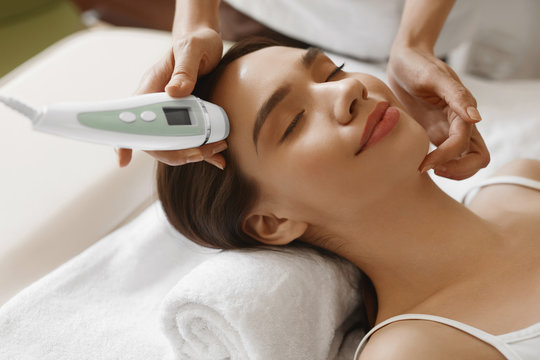 Skin Care. Women Analyzing Facial Skin With Analyzer. Beauty