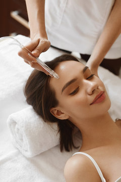 Facial Beauty Treatment. Woman Getting Oxygen Water Skin Peeling