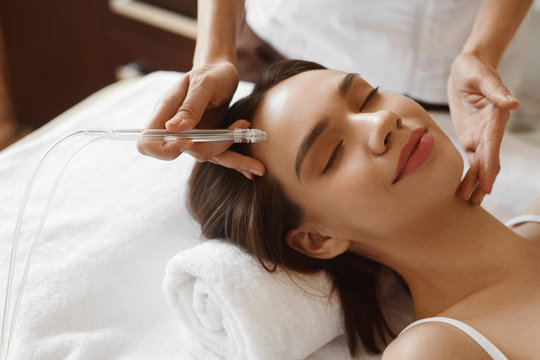 Facial Beauty Treatment. Woman Getting Oxygen Water Skin Peeling