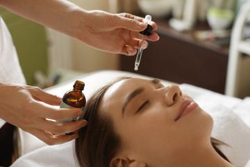 Face Skin Care. Woman Receiving Serum Treatment In Beauty Salon