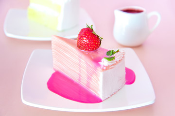 Sweet Crape cake with strawberry on top.