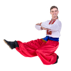 young man wearing a folk russian costume dancing against isolated white with copyspace