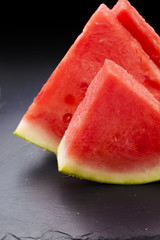 watermelon slices on black slate