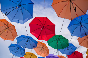 Fototapeta na wymiar Installation from multicolored umbrellas in the park of the city of Astana, Kazakhstan