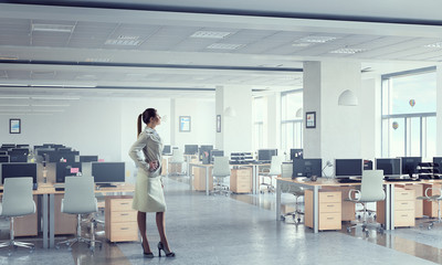 Businesswoman in modern office  . Mixed media